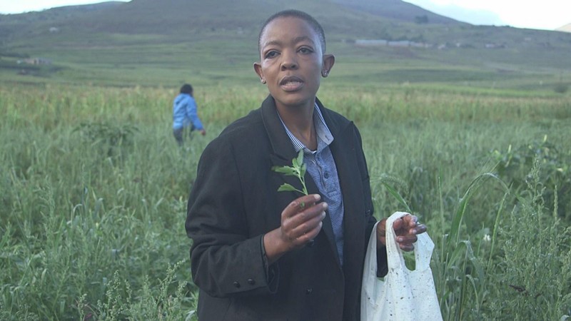 Ska Moteane from Lesotho showing a kind of plant that is used as vegetable. She is an award winning Basotho chef for promoting traditional Basotho recipes.