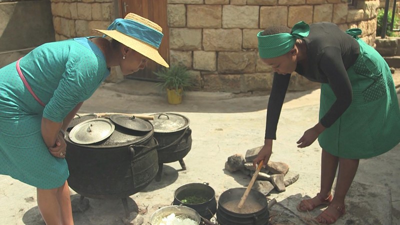 Ska, right showing Lesotho's queen Masenate Seeiso how to prepare some of the traditional dishes.